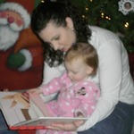 Reading her new Olivia the Pig book at Christmas