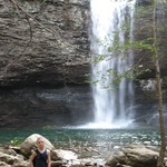 My son standing at the waterfall