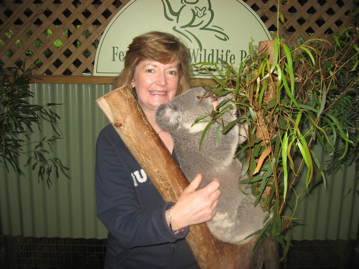 Me cuddling a koala bear in Oz