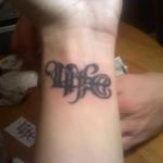 my new tat it says life one way and death the other way