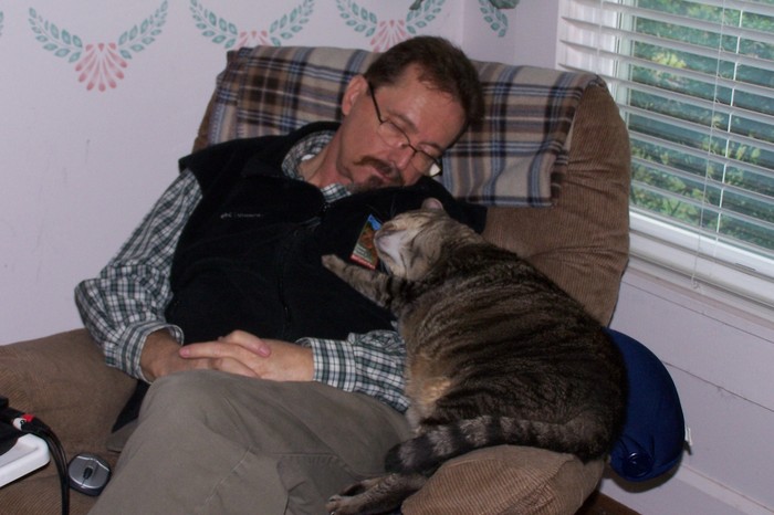 Taking a nap with Mr. Bill, my 23 lb. cat.
