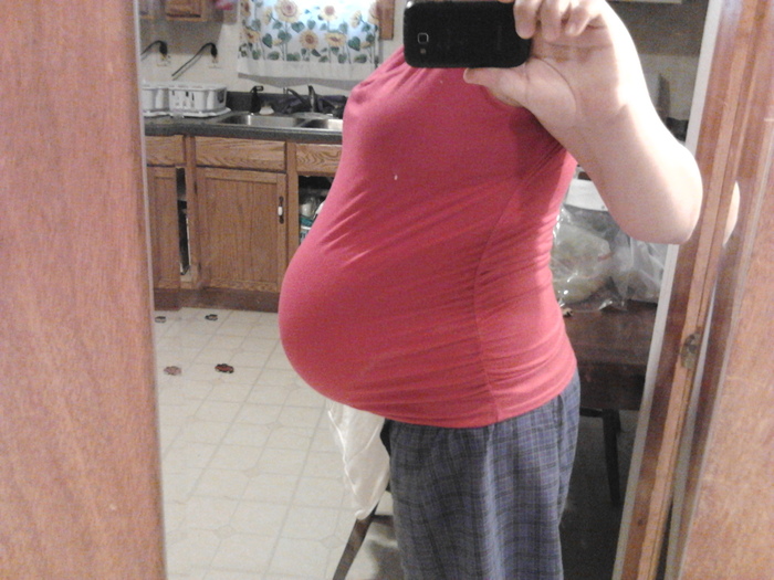 only half dressed, but i found a shirt that still covers the lower part of my belly!!!