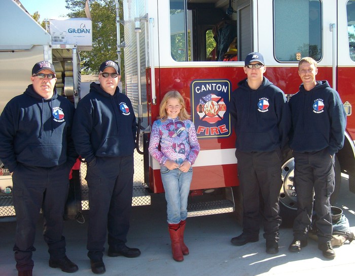 Hannah with members of our fire dept.
