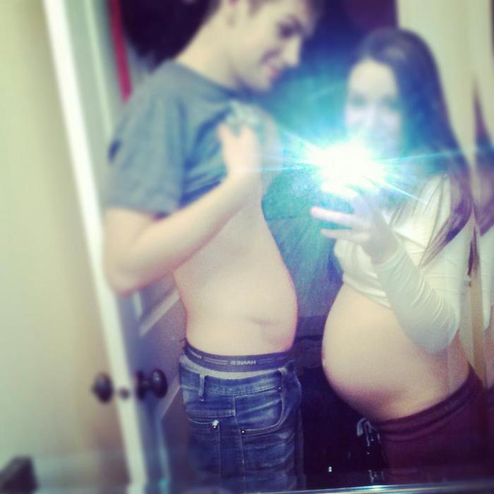 Hubby and I comparing bellies.(;