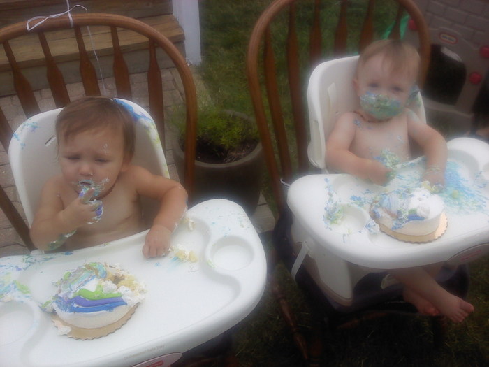 sister and brother enjoying their 1st birthday