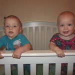 Standing for their first time in the crib...7 months.