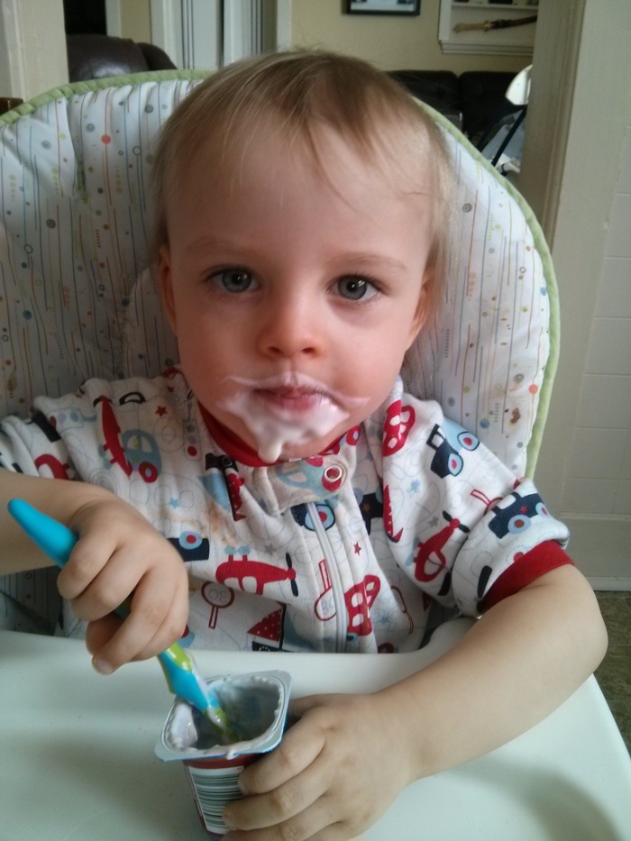 Making a mess of his yogurt today