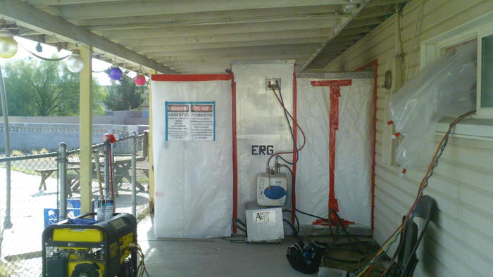 The asbestos containment and shower for the workers out the backdoor.
