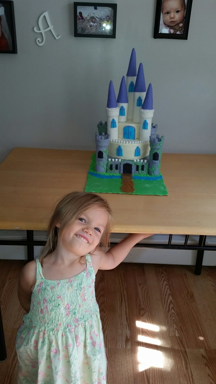 the little princes posing with her cake