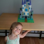 the little princes posing with her cake
