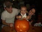 Caiden checking out his Pumpkin (that he helped carve) hehe