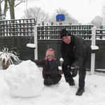 Lia and grandad making a Snowman