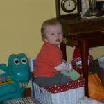 Sitting in his book basket and reading.