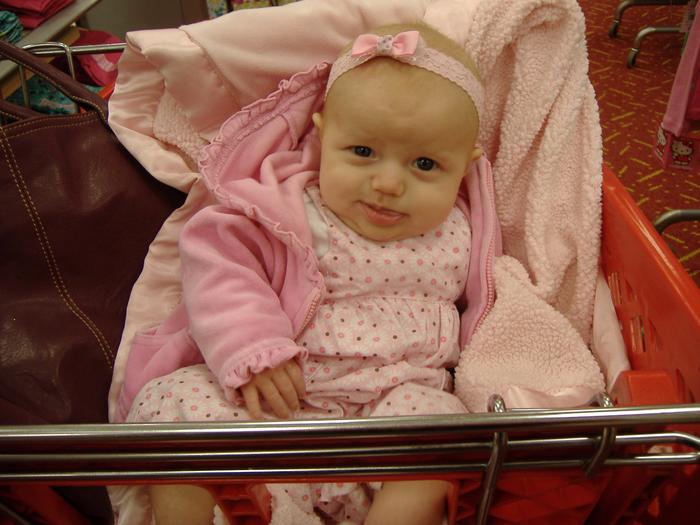 Addy's first time sitting up by herself in a cart!