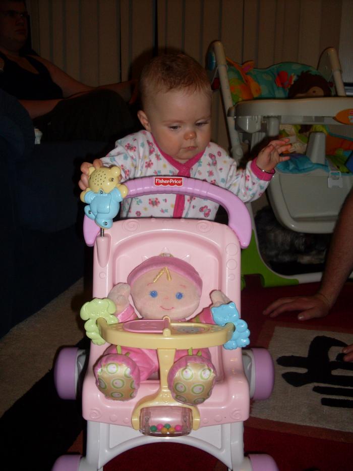 With her dolly in the pram
