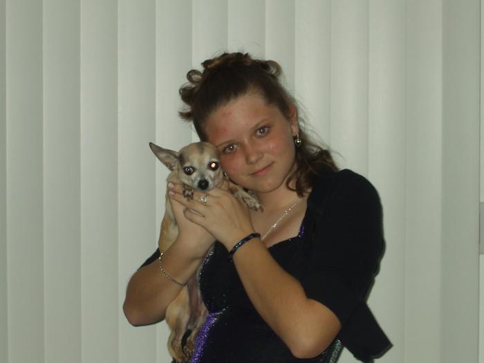 My daughter with our Chihuahua, Rayna