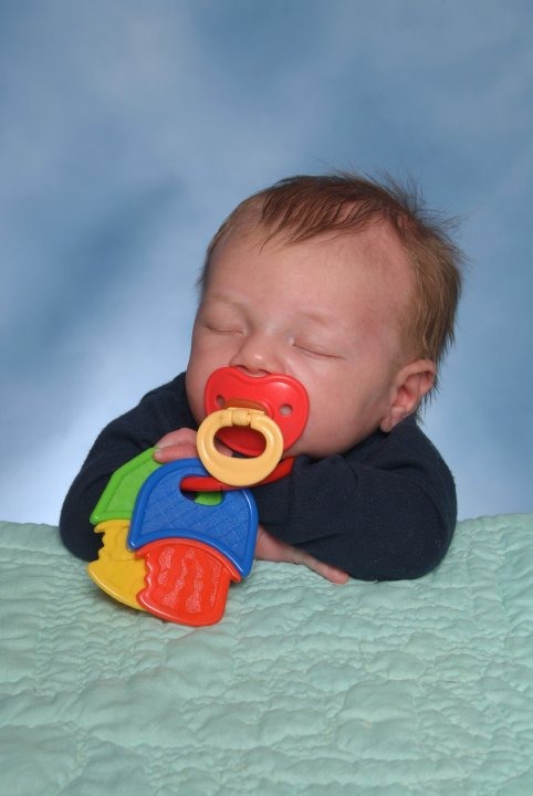 Sleeping with his pacifier in his mouth