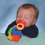 Sleeping with his pacifier in his mouth