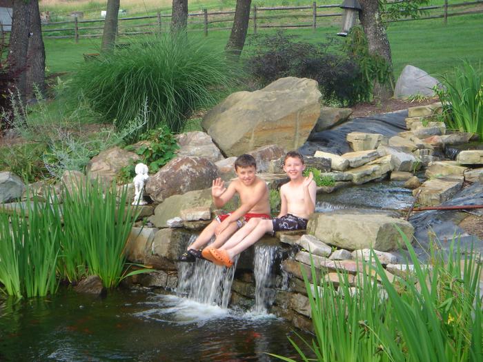my grandson Bobby & neighbor friend Shawn in the Koi pond