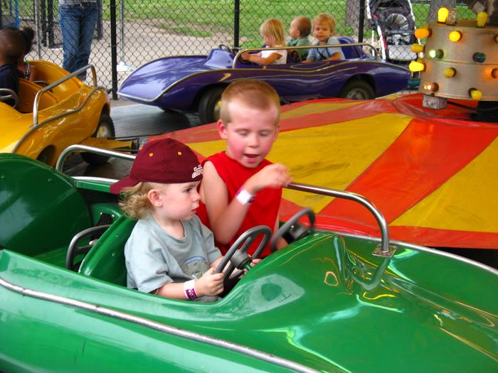 Hunter telling Dalton how to drive:~) His first ride!! 21 months old:~)
