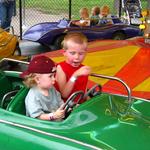 Hunter telling Dalton how to drive:~) His first ride!! 21 months old:~)