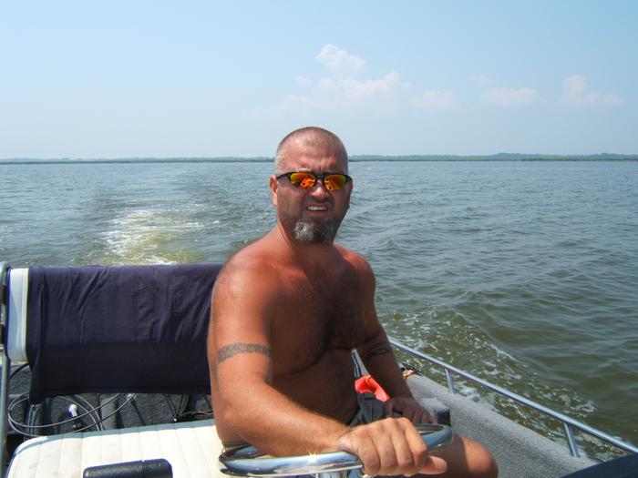 HUSBAND IN OUR BOAT IN CURRITUCK SOUND
