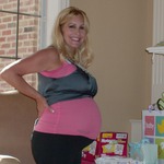 Twin belly,I went from 124lbs to 152lbs.Both boys are verticle with their feet at the top of my ribs