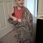 Put on his shoes, shirt, pants, and daddy's uniform top and said he was "go work"...lol