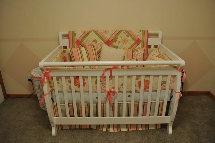 Nina's crib. My aunt made the quilt, bumper, pillows etc.