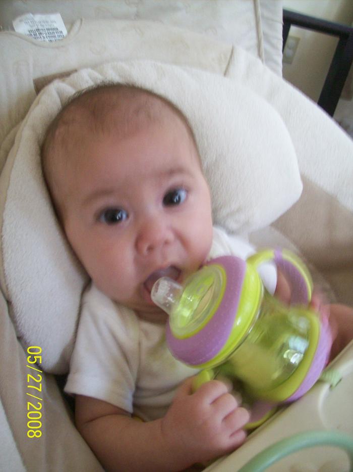 Nya trying to drink her 1st sippy cup.