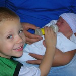 Emerson Feeding His Baby Brother