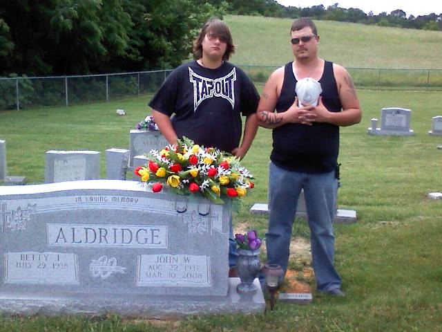 me and my nephew who is also my best friend at my granfathers grave