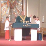 Makaila serving mass for the last time with our priest before he retired...