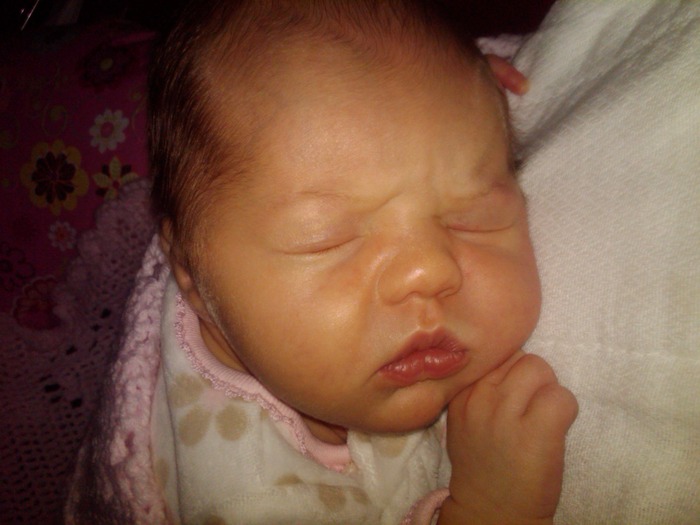 8 days old. Her cheeks are growning!