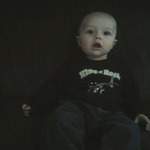 Coles first 9 month winter shirt! and hes only 6 months :( lol