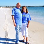 My Husband & I on the Beach outside our front door. A Paradise!
