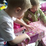 helping sissy open presents.