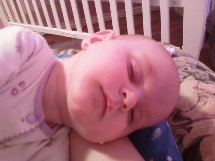passed out...note the milk dangling from her cheek LOL