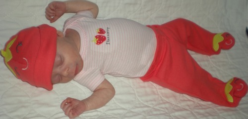 In her strawberry outfit 