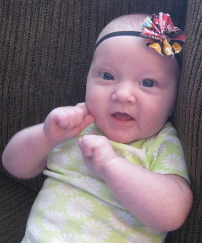 Lyla in her headband mommy made =)