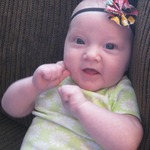 Lyla in her headband mommy made =)