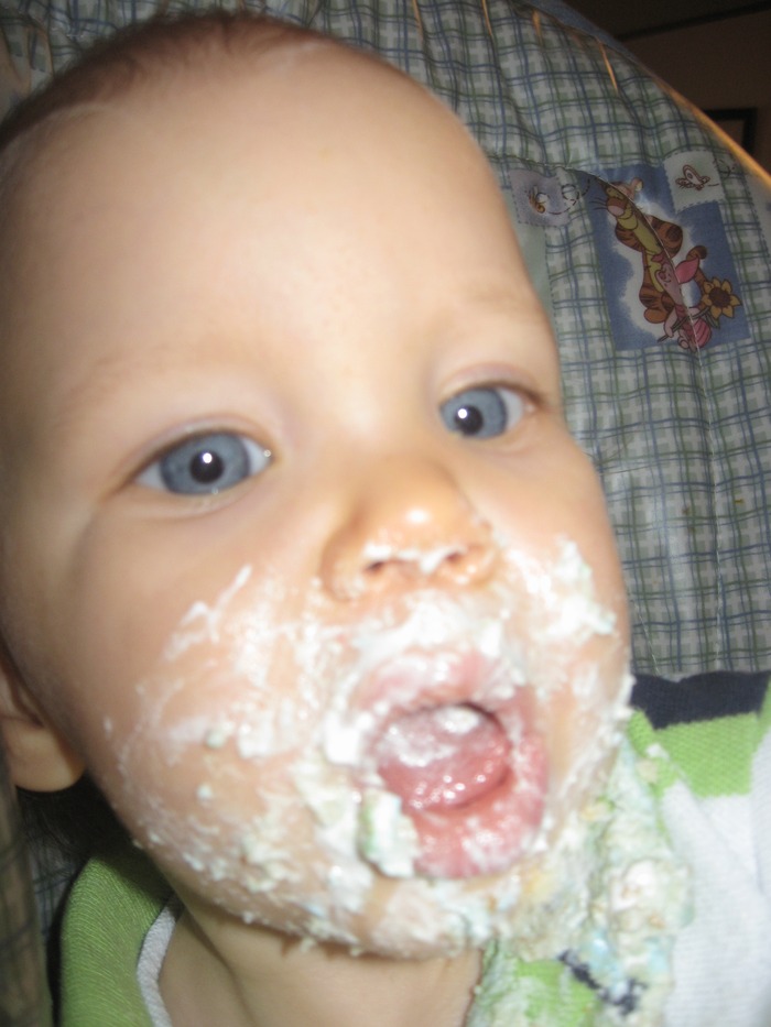 Connor eating his 1st birthday cake
