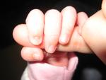 My tiny hand and Mommy's GIANT pinkie!