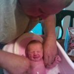 Daddy given her first bath