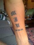 my daughters' initials & b-day in old-english on inner left arm