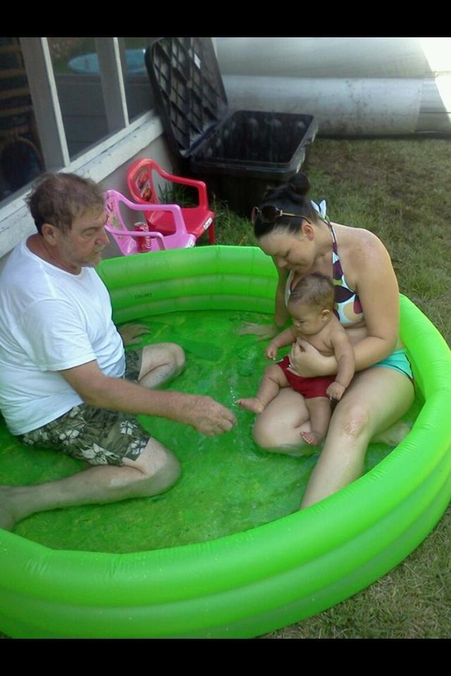 In the pool with mom and PawPaw