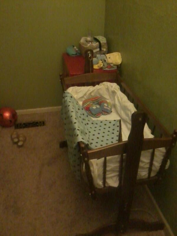Just the cradle in our room with dresser full of goodies beside it.  Getting pretty excited!