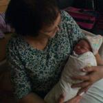 Nana Carol holding her 6th grandchild