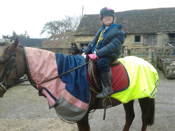 My 8 year old grandson on his horse Harvey