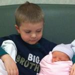 Proud big brother Dylan and baby Madison